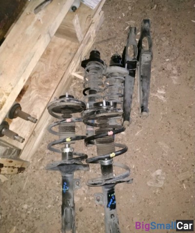 Стойка амортизатора mitsubishi lancer 10