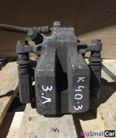 Суппорт задний левый тойота Камри 40